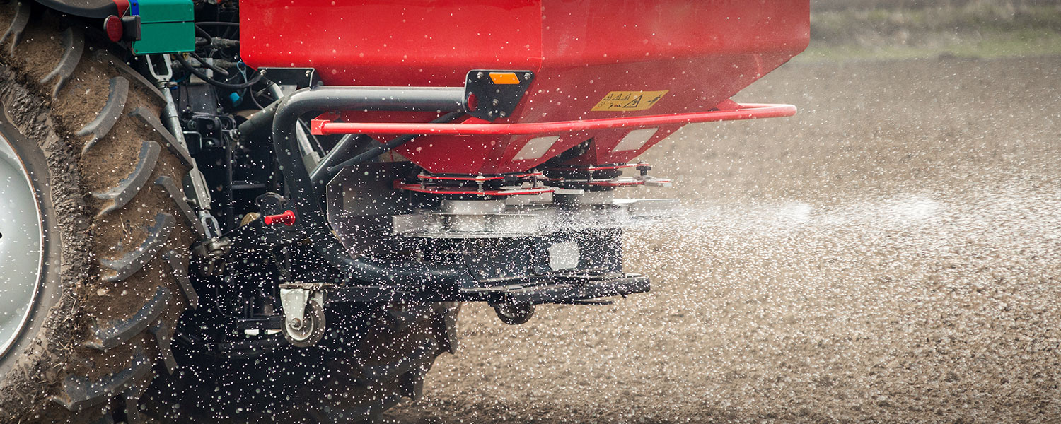 Tractor fertilising crops