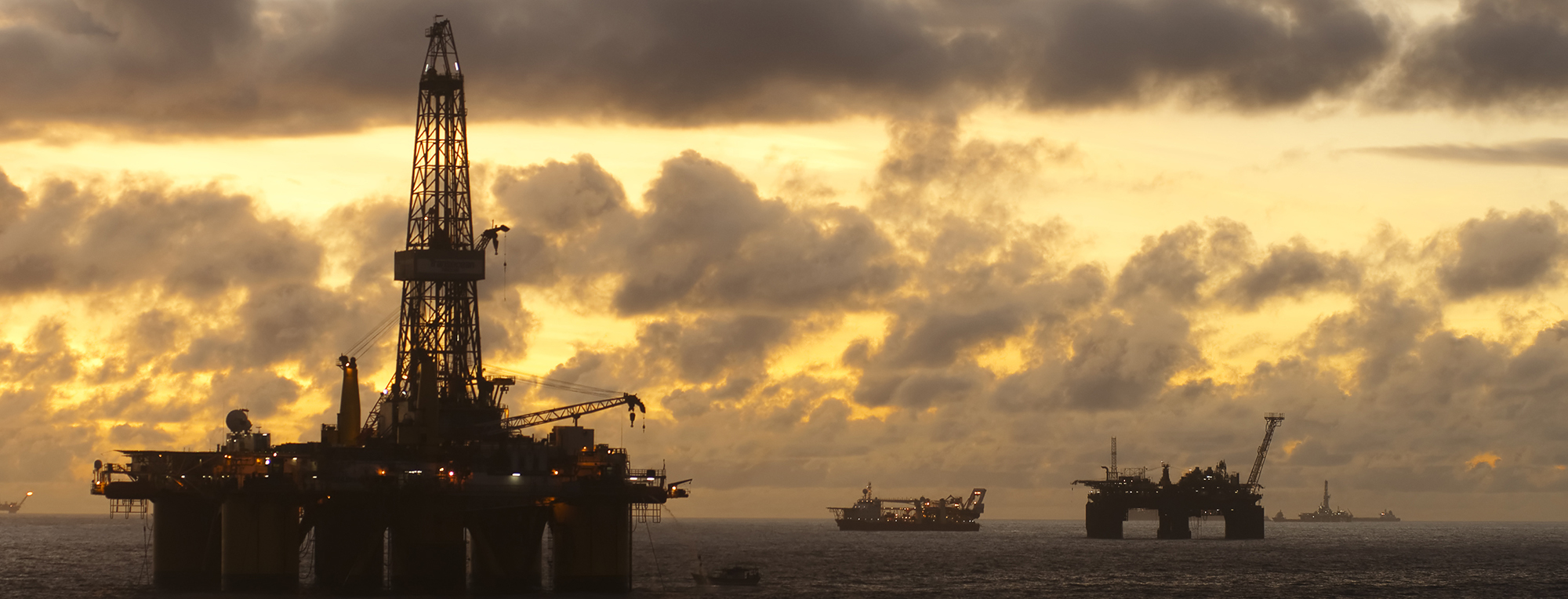 offshore oil field at sunset