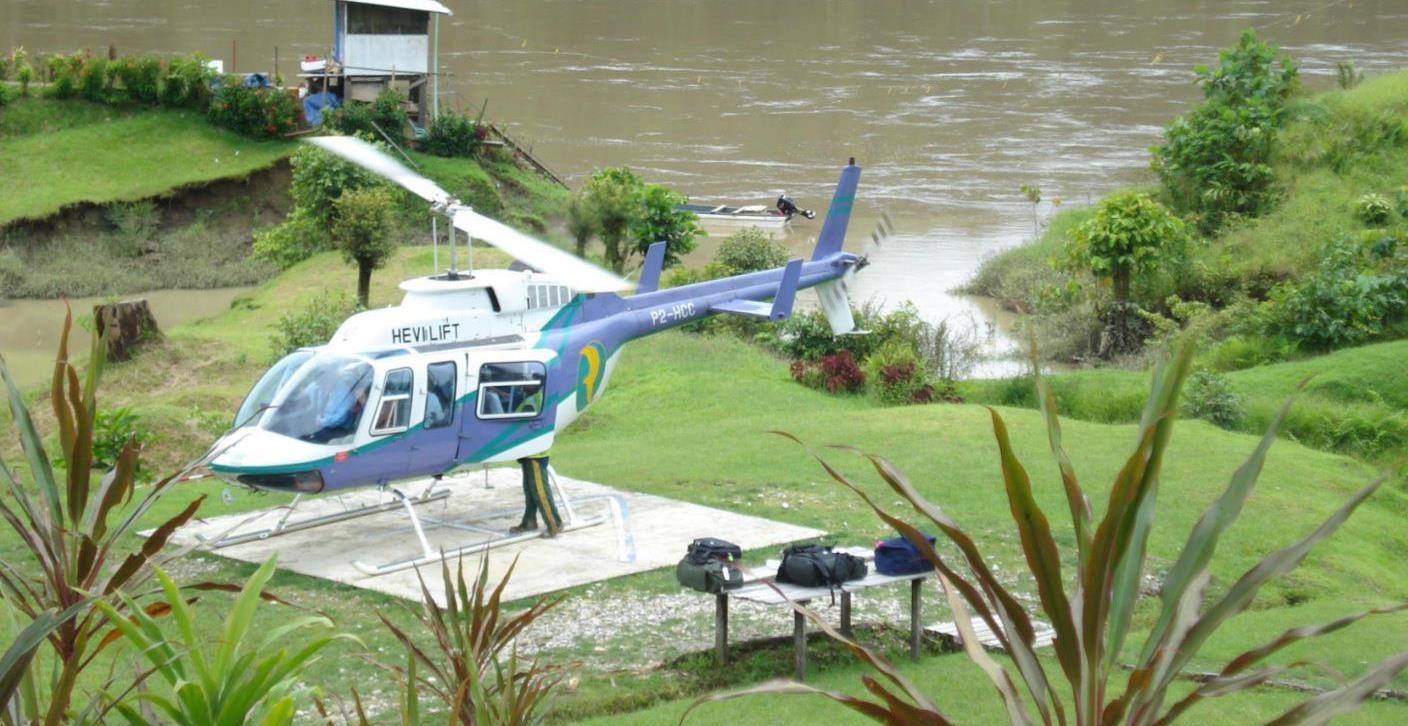 Helicopter on pad near river