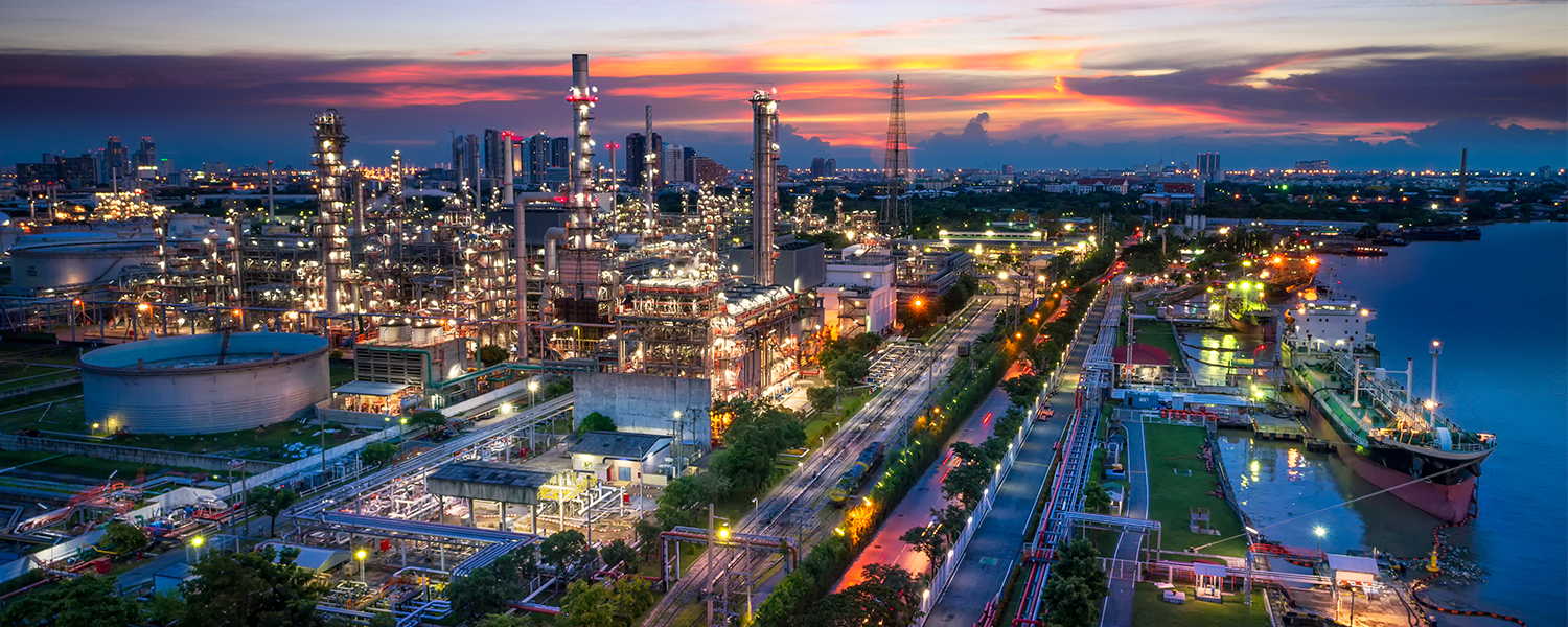 Aerial view of oil refinery and petrochemical plant at twilight.