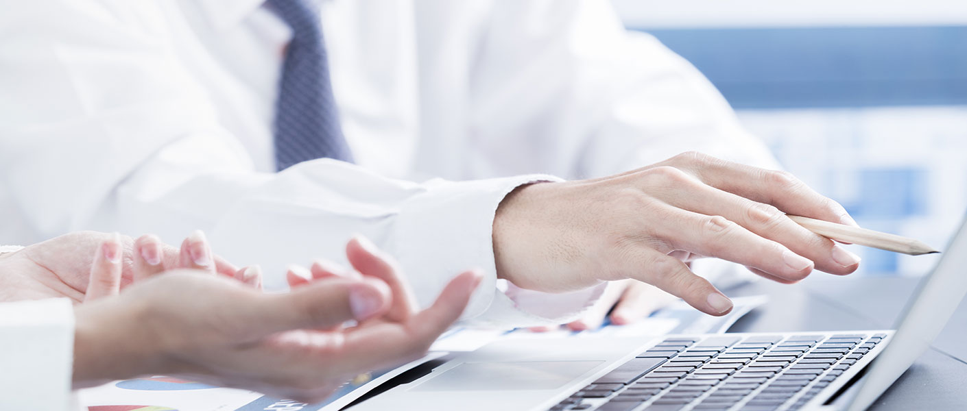 Business people looking over document