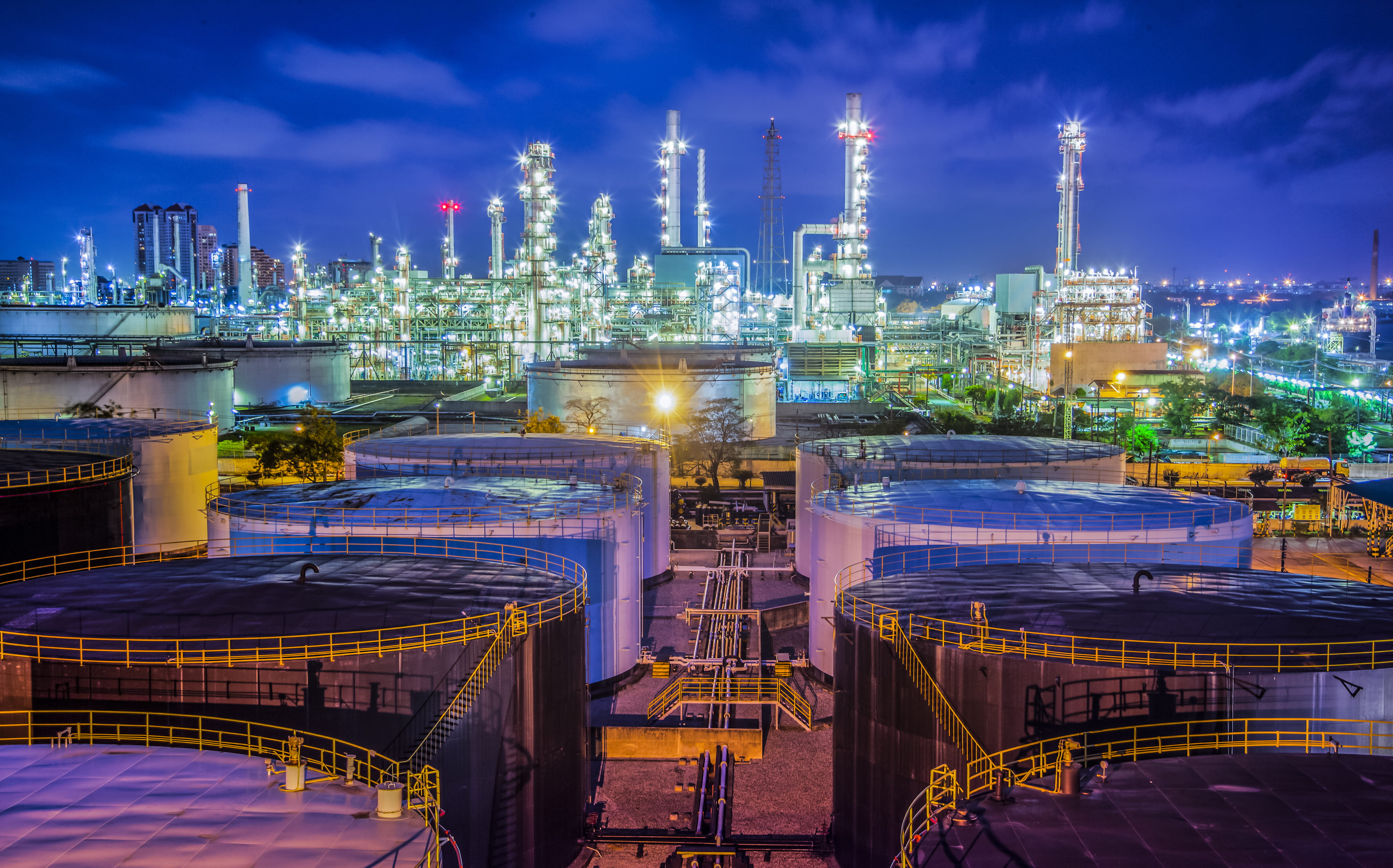 twilight view of gas plant and storage tanks