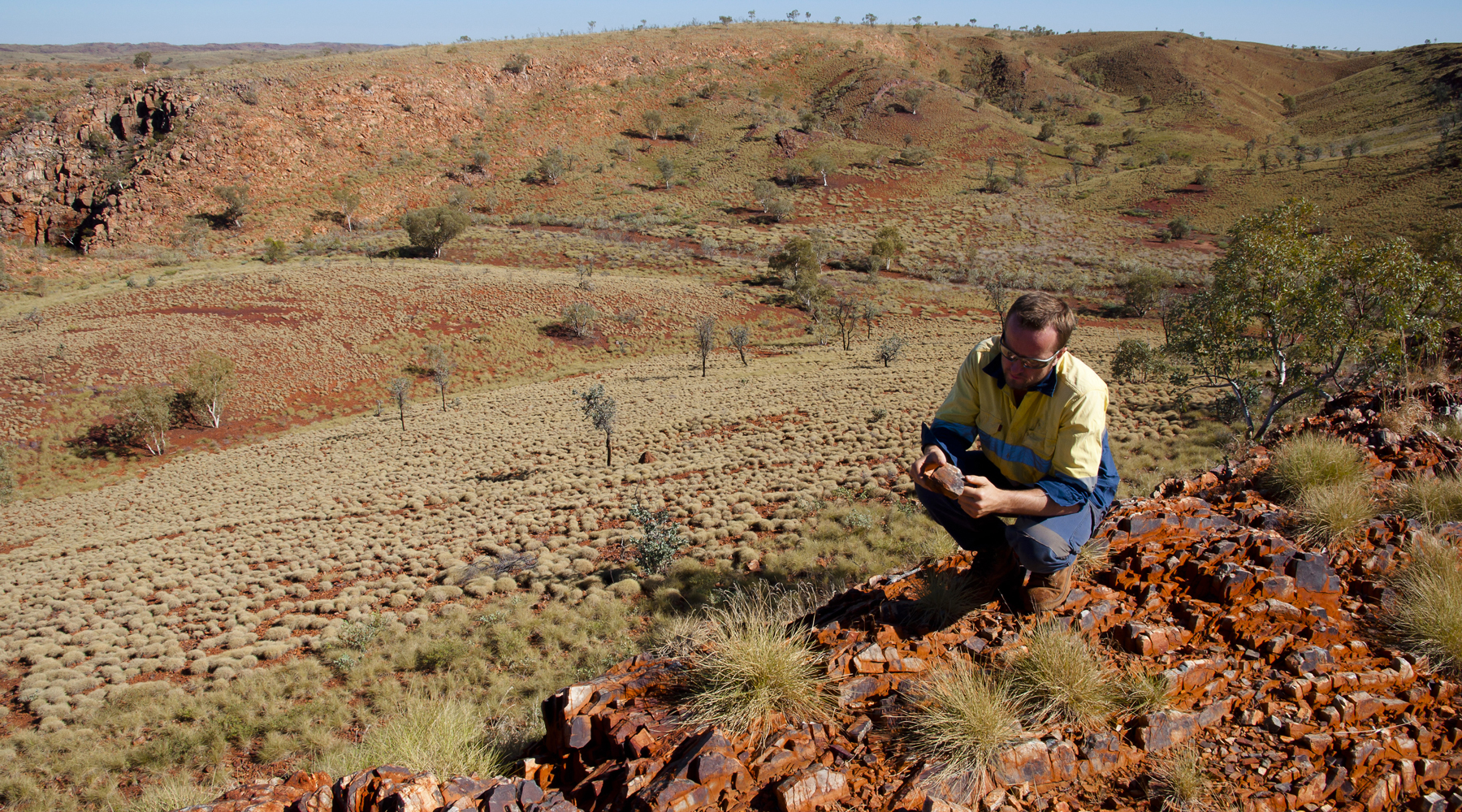Geologist Examining a Banded Iron Formation- Pilbara - Australia