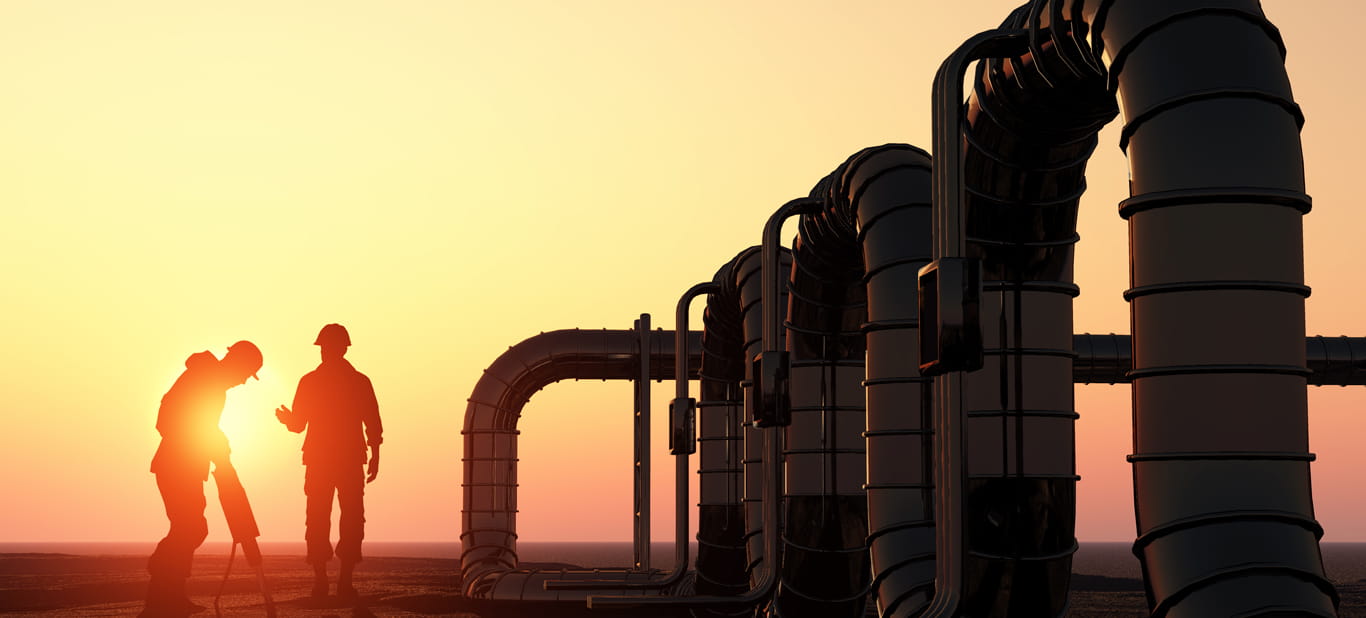 sunset, two engineers near gas pipline